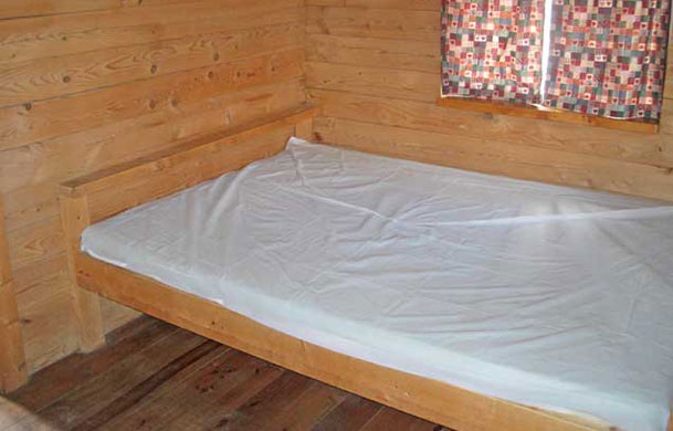 2 room rustic cabin rental interior bed